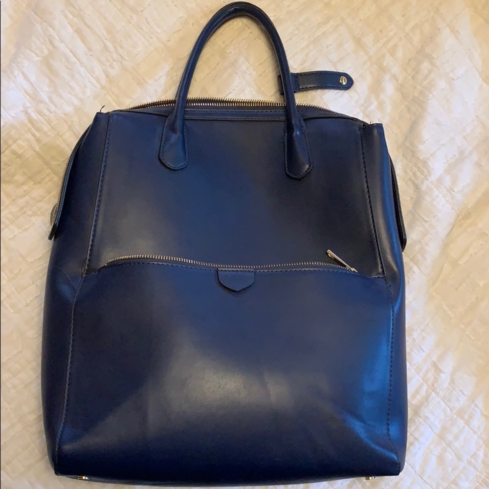 Blue faux leather convertible backpack and purse.